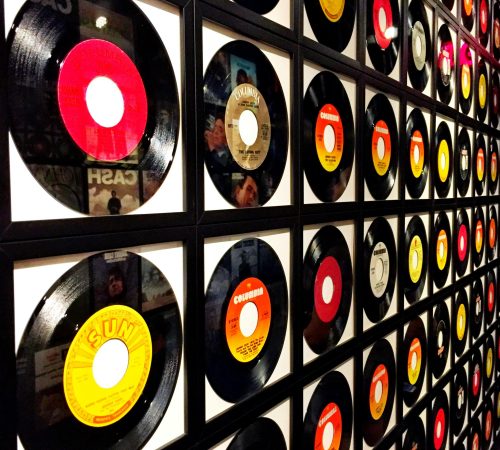 pexels-photo-908965-908965 Colorful vinyl records framed and displayed on a wall, showcasing a retro music theme.